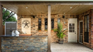 Backyard with a bar, grill, and Texas sign